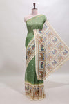 Green checked geometric motifs linen cotton saree with contrast ikkat style border and blouse