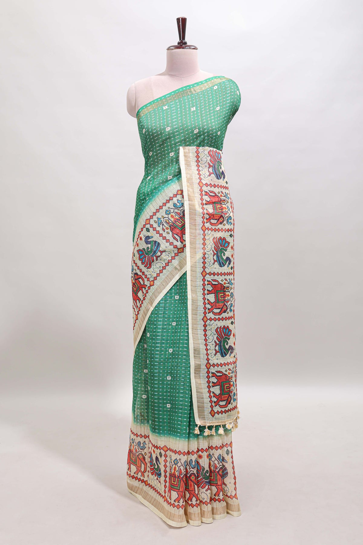 Green checked geometric motifs linen cotton saree with contrast ikkat style border and blouse