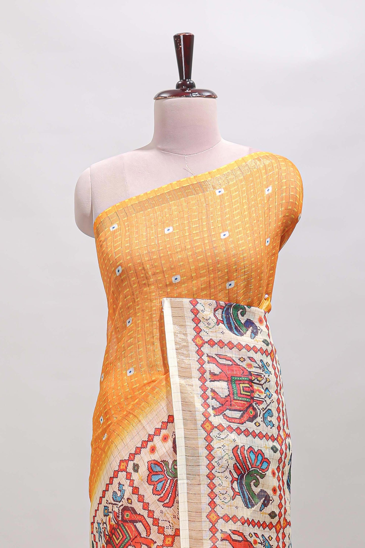 Yellow checked geometric motifs linen cotton saree with contrast ikkat style border and blouse