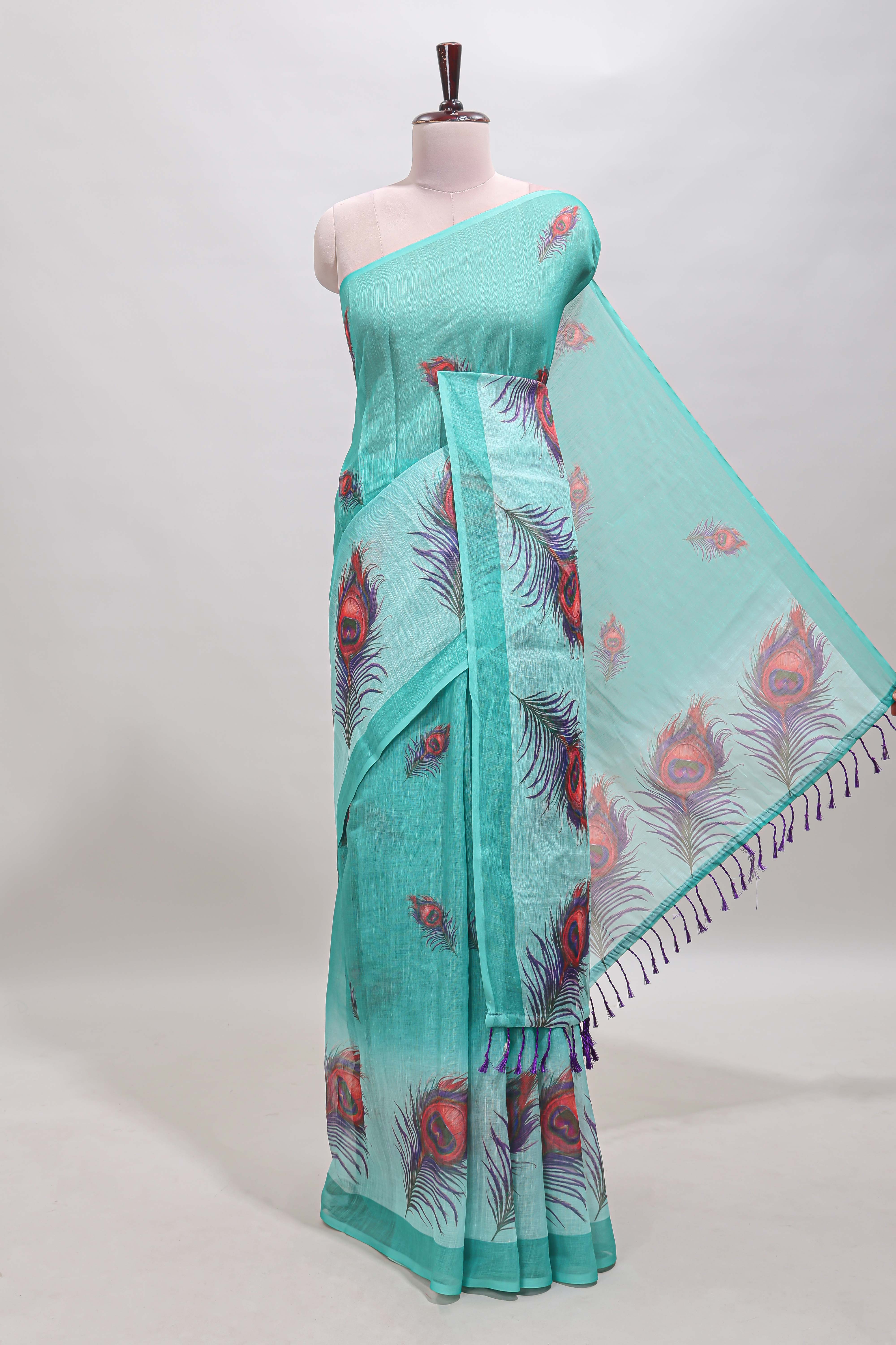 Green peacock feather motifs linen cotton saree with self border and matching blouse