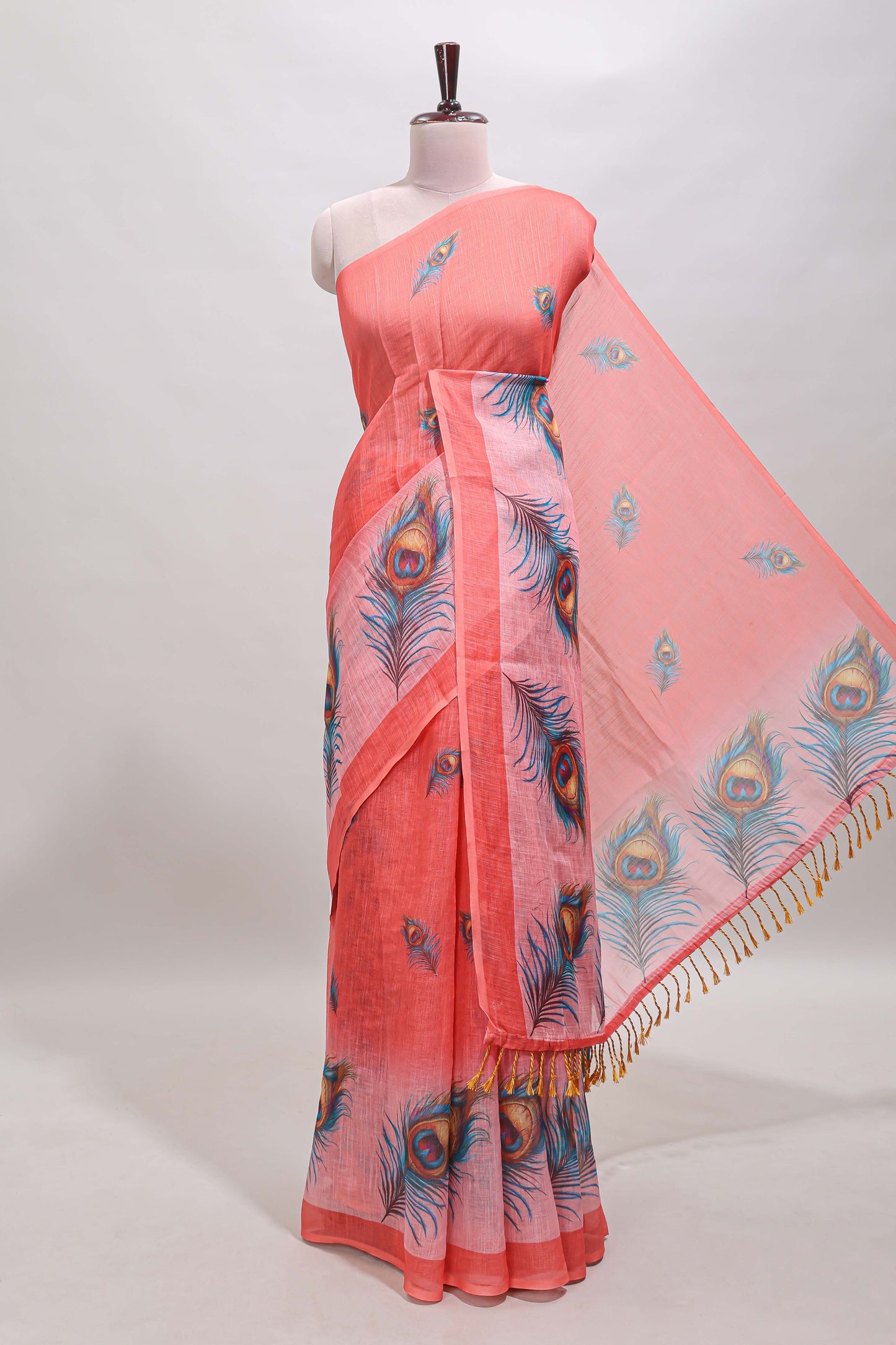 Orange peacock feather motifs linen cotton saree with self border and matching blouse