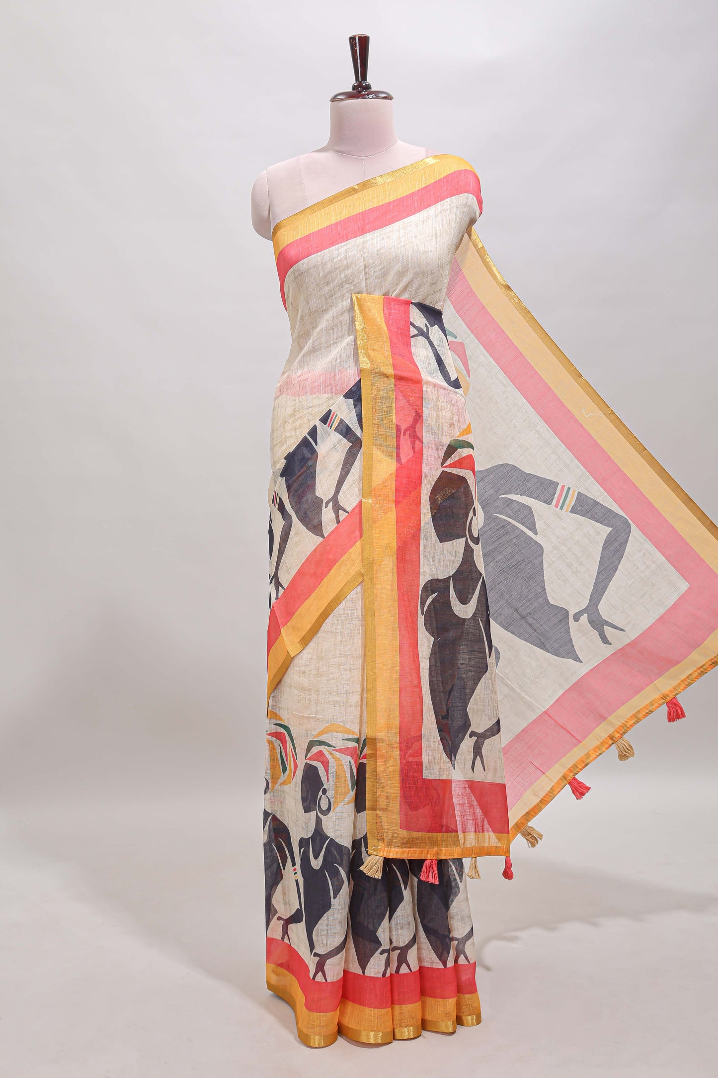 Beige artistic traditional tribal print linen cotton saree with contrast border and multi color blouse
