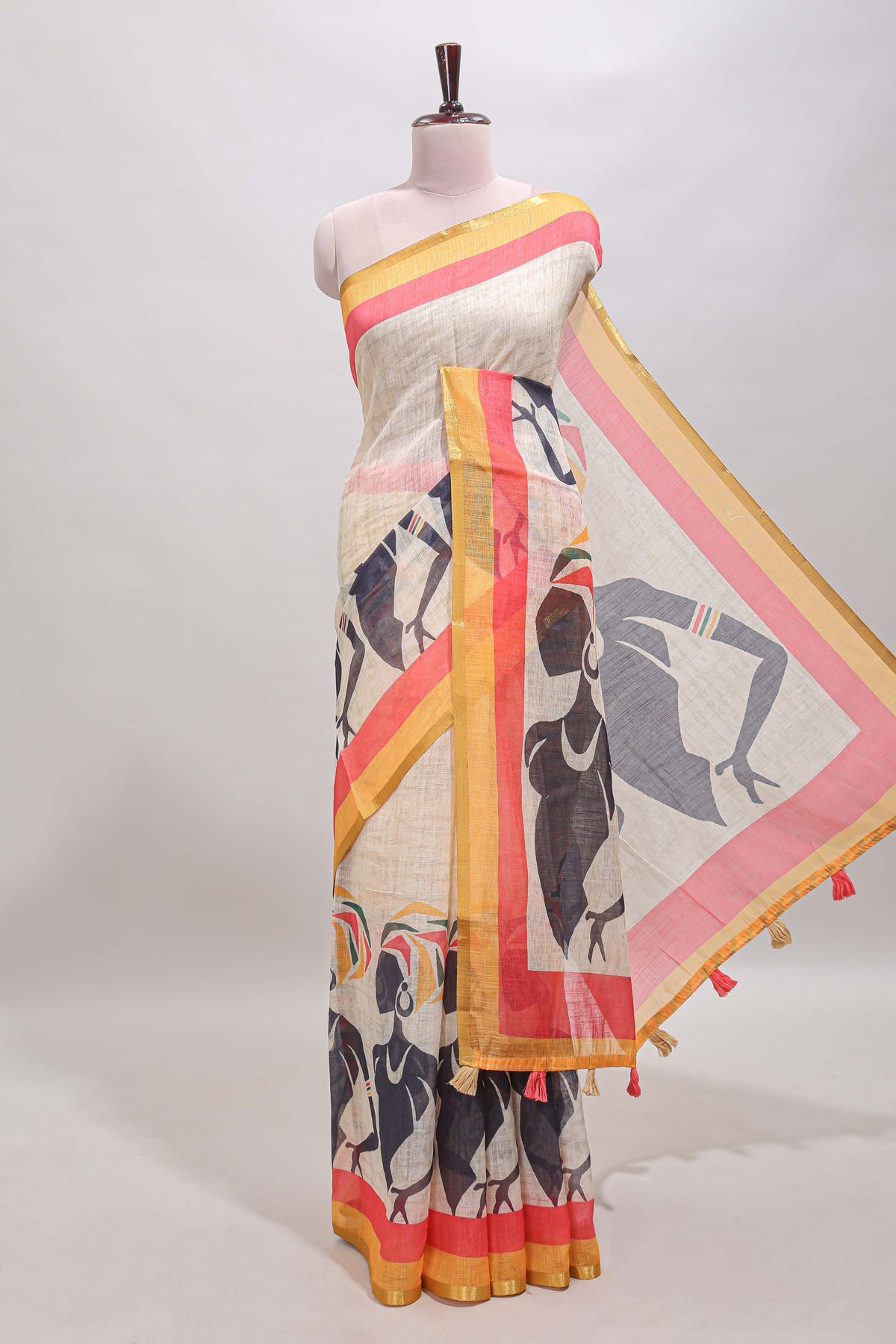 Beige artistic traditional tribal print linen cotton saree with contrast border and multi color blouse