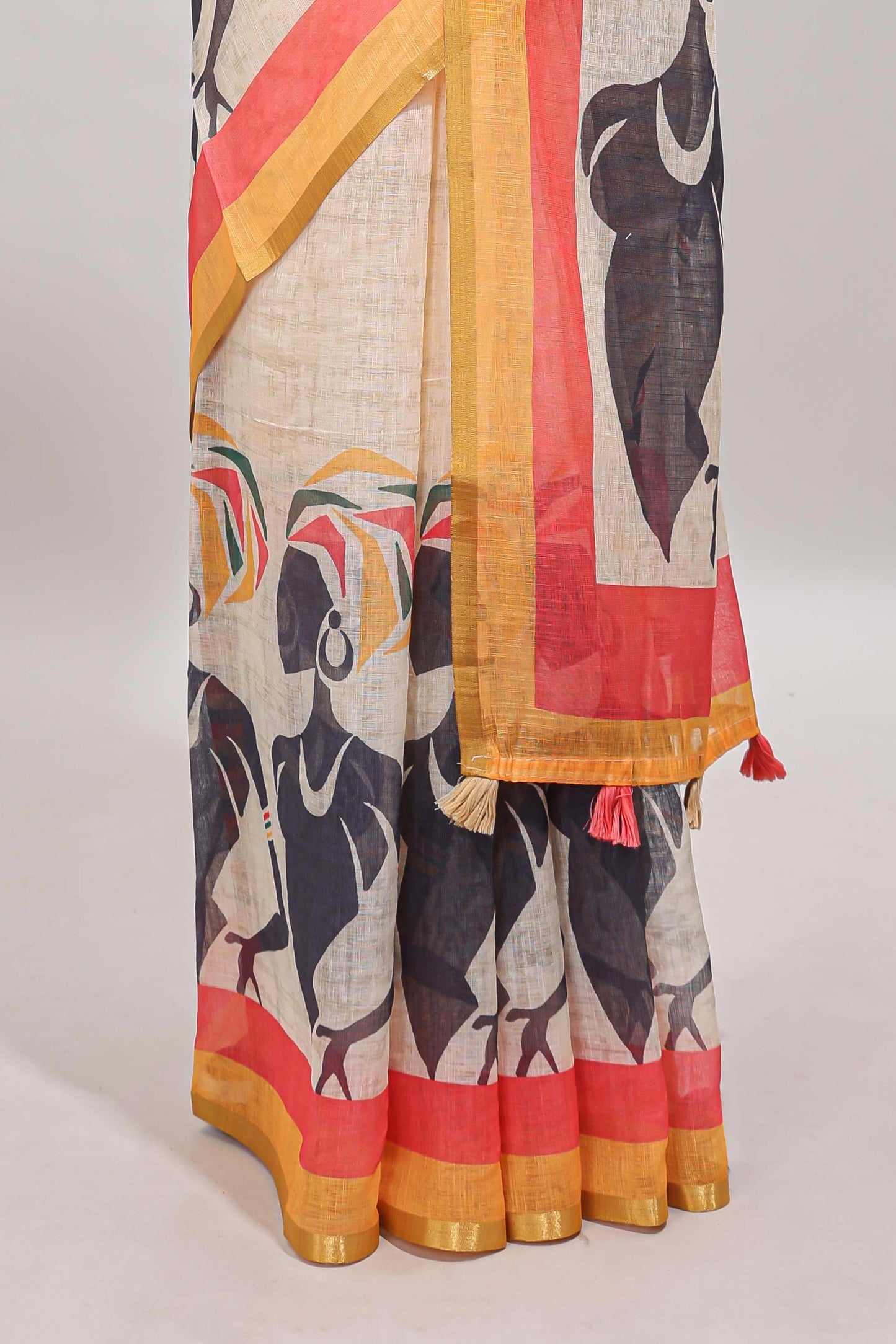Beige artistic traditional tribal print linen cotton saree with contrast border and multi color blouse