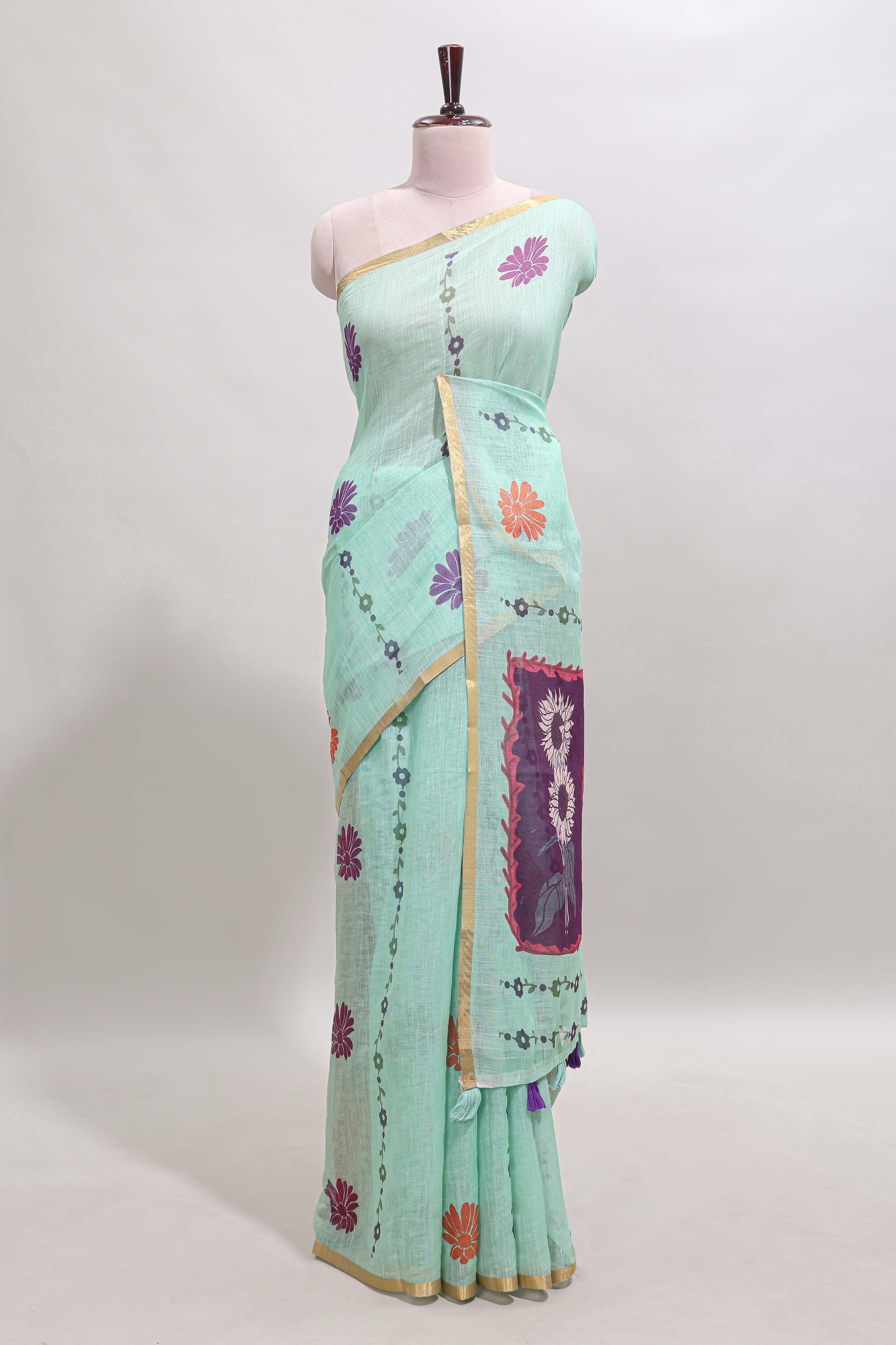 Pista green floral design linen cotton saree with self zari border and contrast blouse