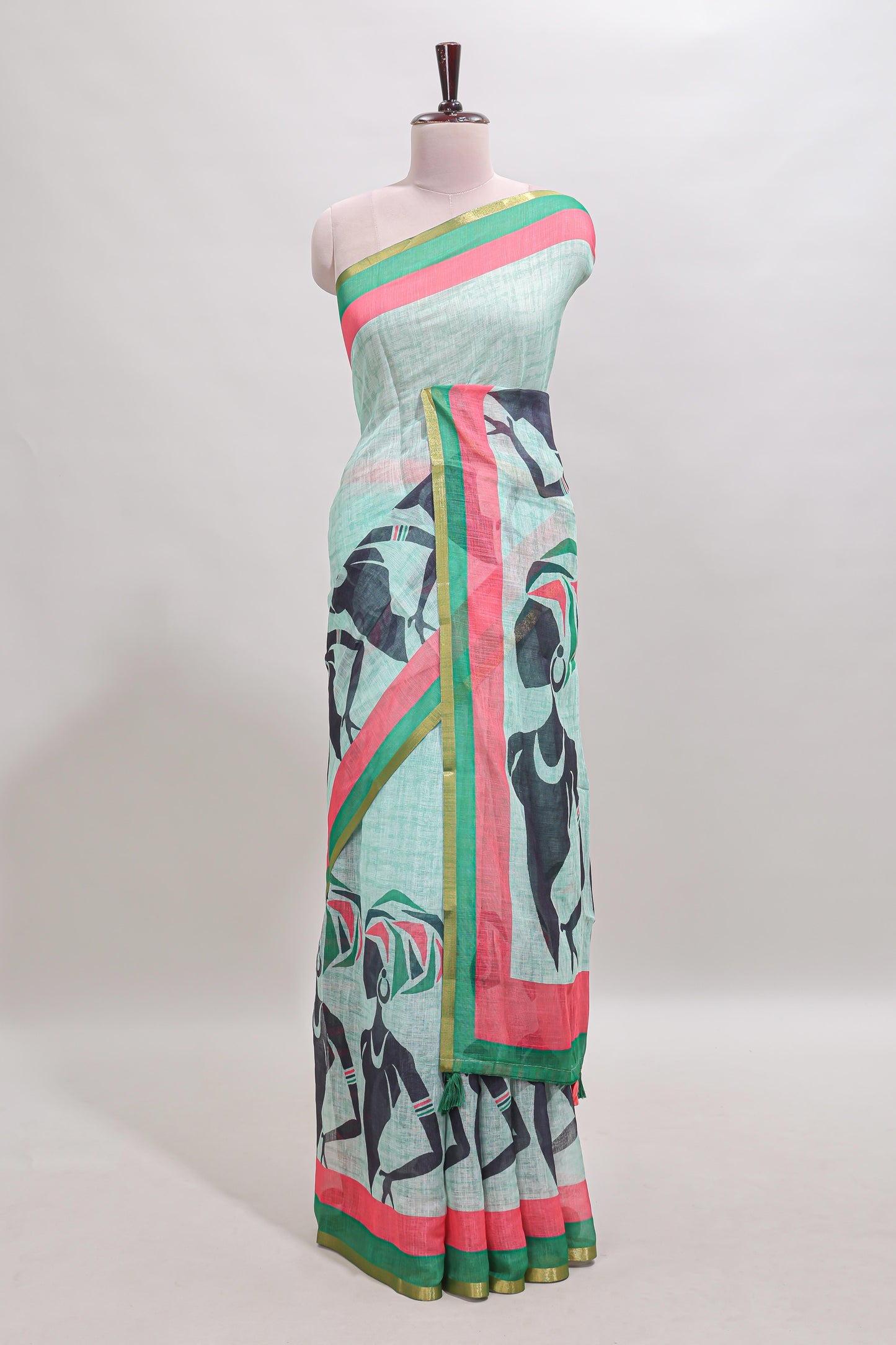 Light green artistic traditional tribal print linen cotton saree with contrast border and striped blouse