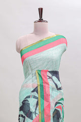 Light green artistic traditional tribal print linen cotton saree with contrast border and striped blouse