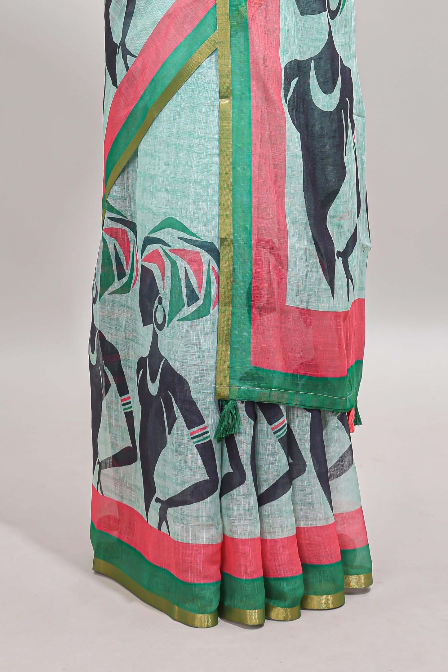 Light green artistic traditional tribal print linen cotton saree with contrast border and striped blouse