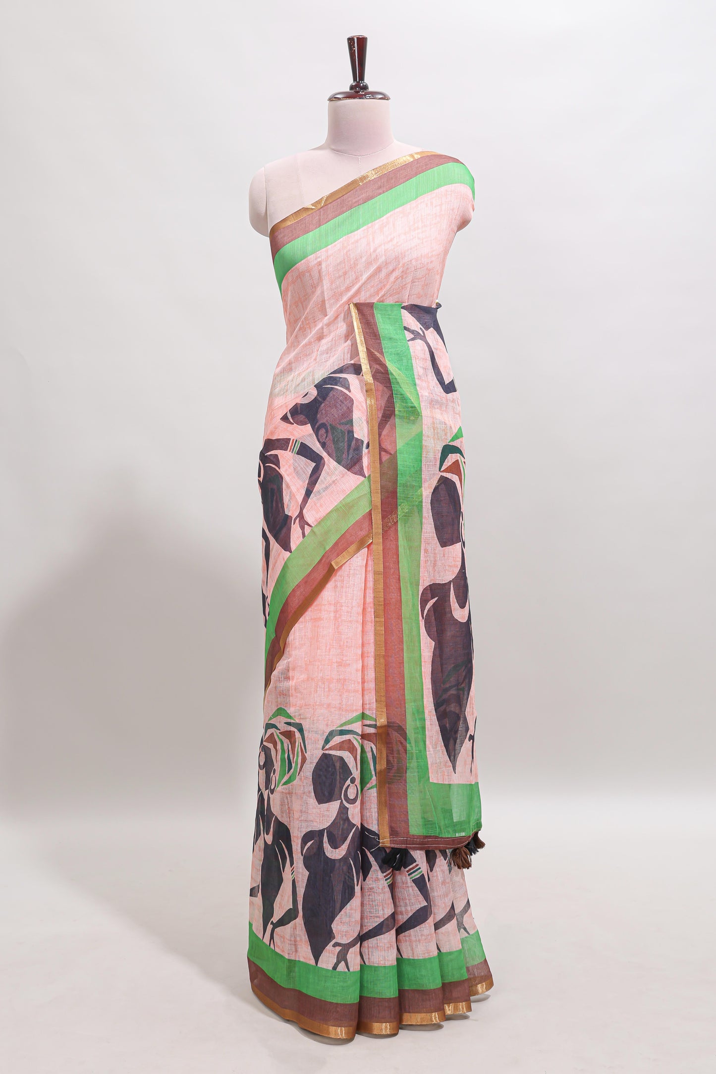 Light brown artistic traditional tribal print linen cotton saree with contrast border and striped blouse