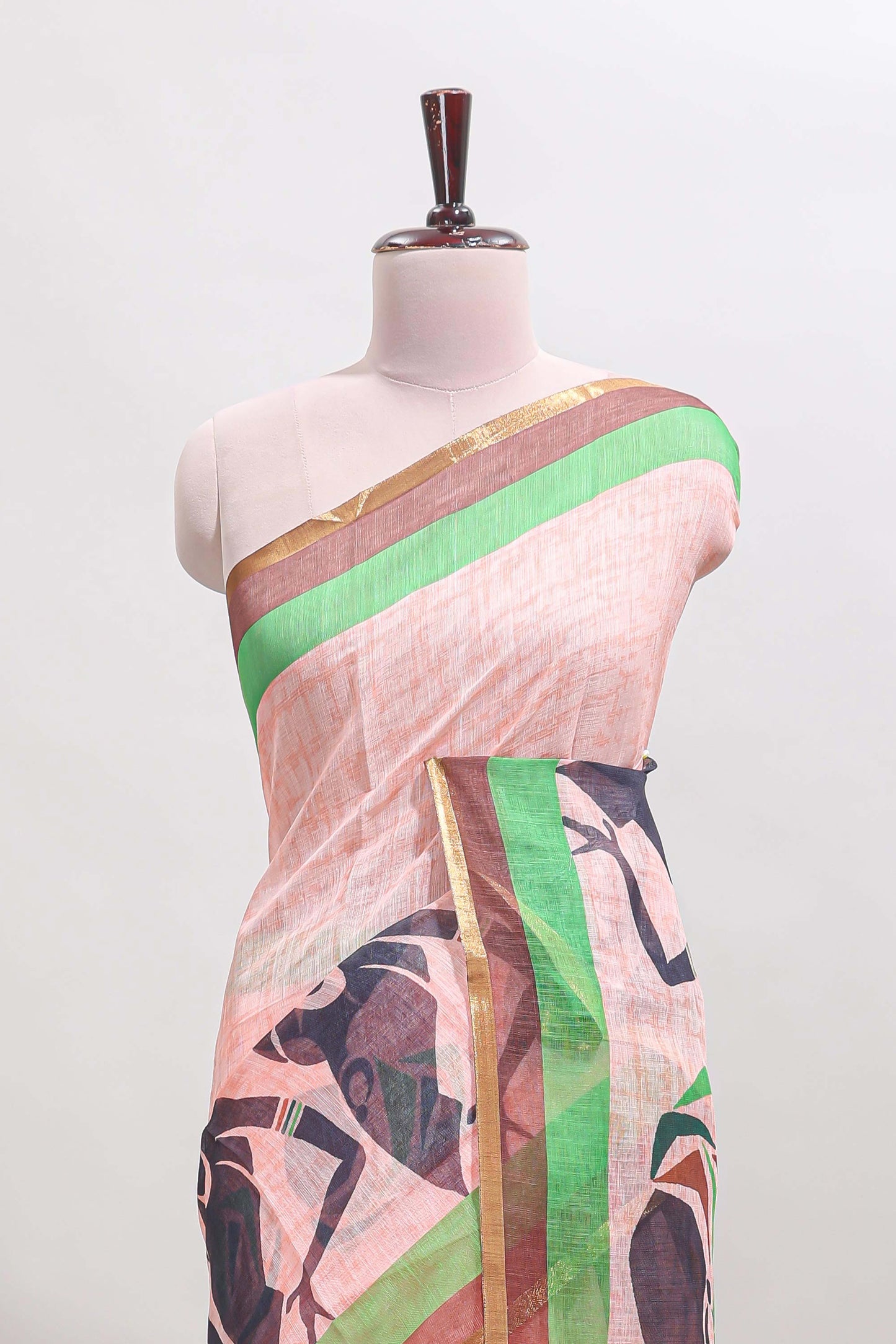 Light brown artistic traditional tribal print linen cotton saree with contrast border and striped blouse