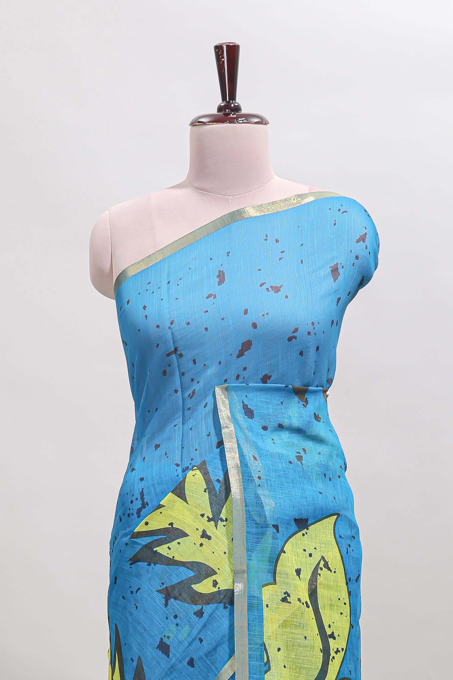 Blue floral design linen cotton saree with self zari border and contrast blouse