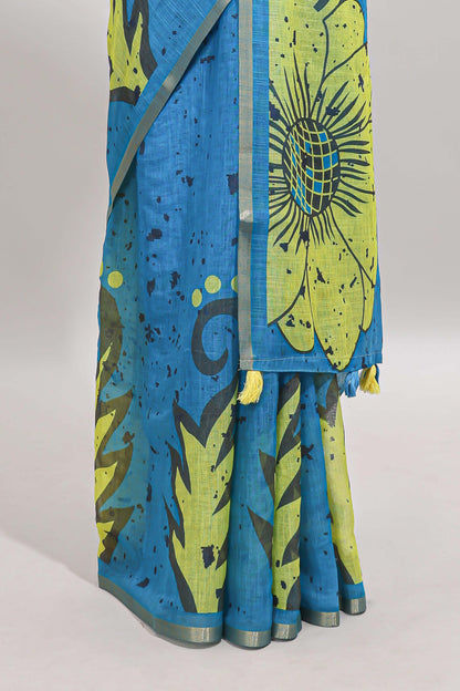 Blue floral design linen cotton saree with self zari border and contrast blouse
