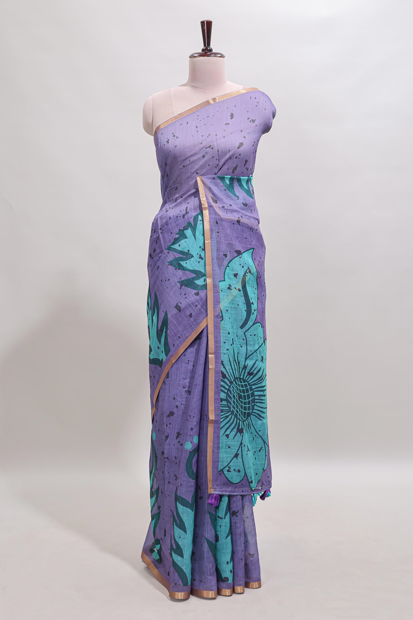Lavender floral design linen cotton saree with self zari border and contrast blouse