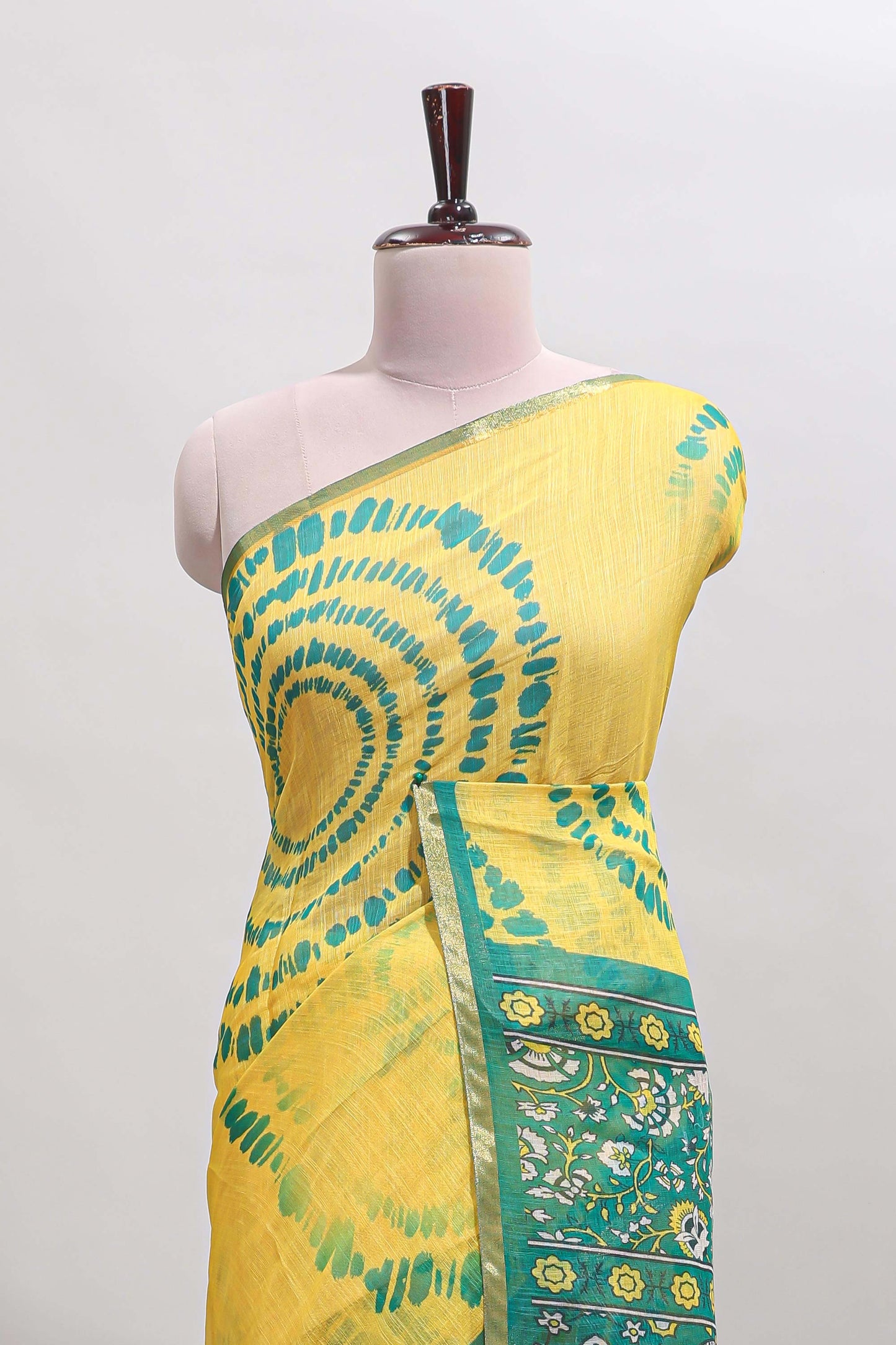 Yellow shibori design linen cotton saree with contrast zari border and printed blouse