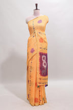 Orange floral design linen cotton saree with self zari border and contrast blouse