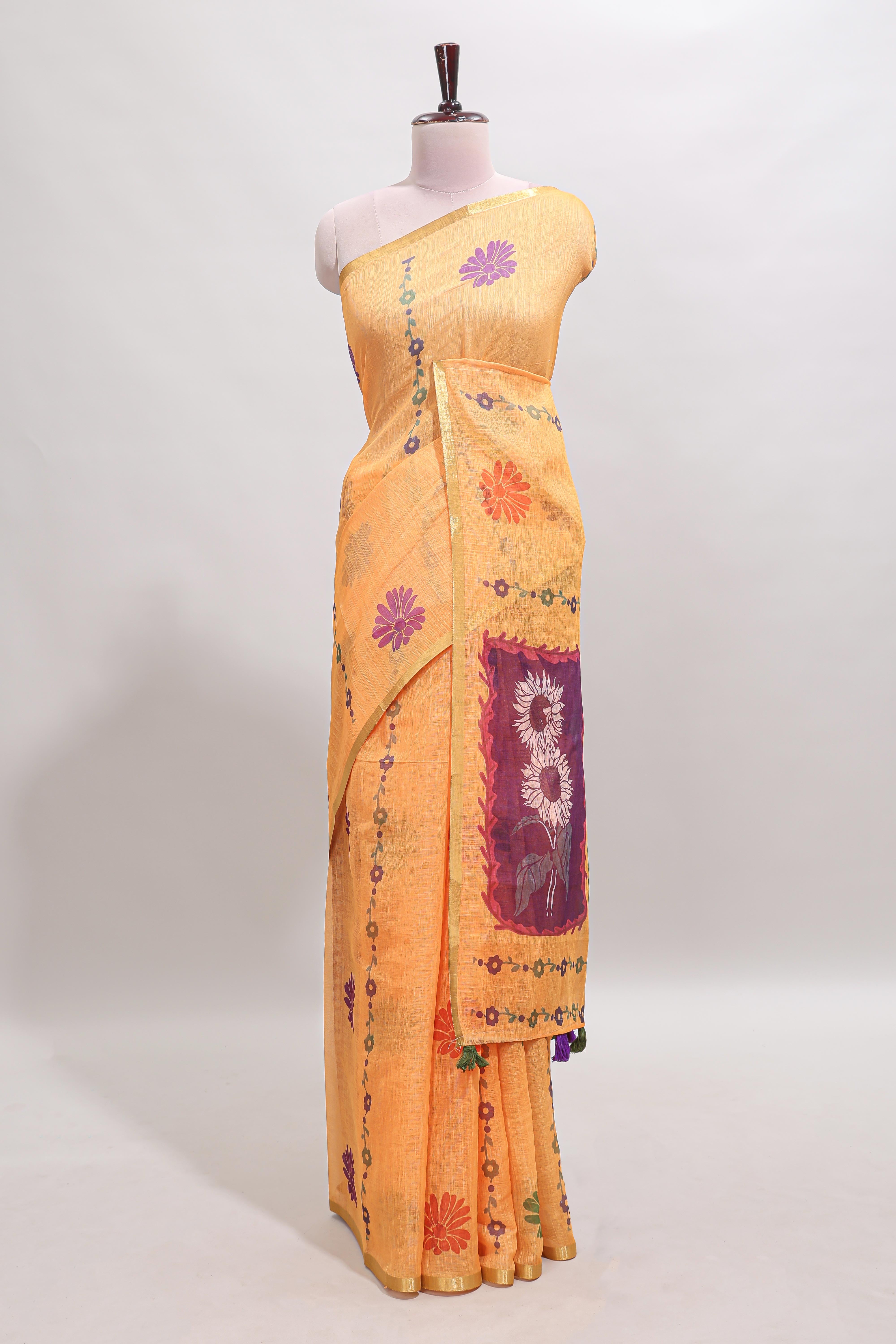 Orange floral design linen cotton saree with self zari border and contrast blouse