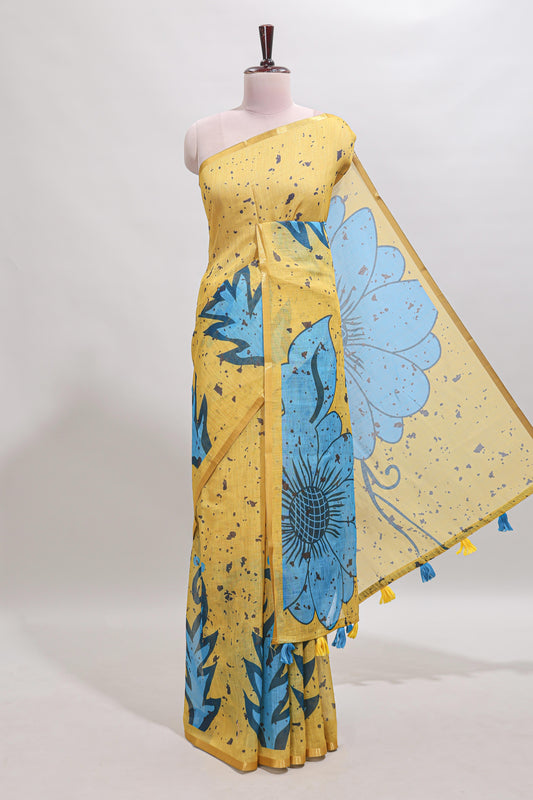 Yellow floral design linen cotton saree with self zari border and contrast blouse