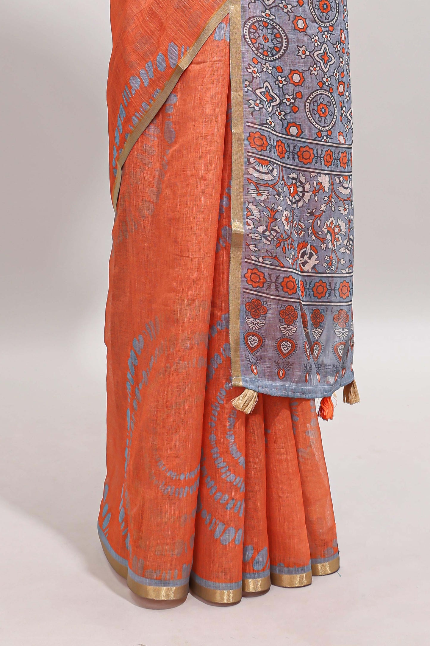 Orange shibori design linen cotton saree with contrast zari border and printed blouse