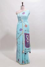 Blue floral design linen cotton saree with self zari border and contrast blouse