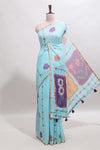 Blue floral design linen cotton saree with self zari border and contrast blouse