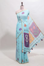 Blue floral design linen cotton saree with self zari border and contrast blouse