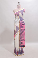 Cream ikkat style linen cotton saree with self zari border and contrast blouse