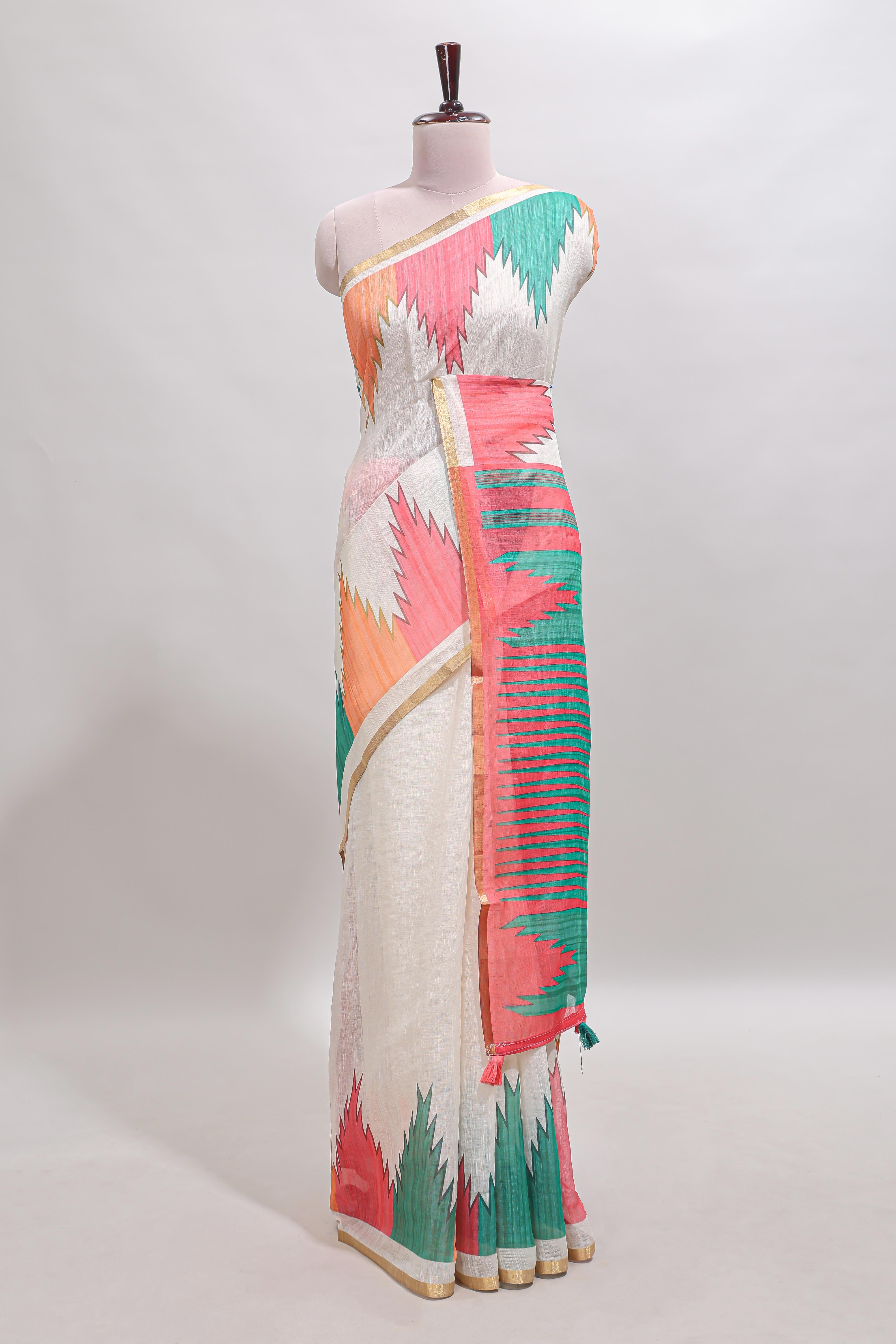 Cream ikkat style linen cotton saree with self zari border and contrast blouse