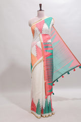 Cream ikkat style linen cotton saree with self zari border and contrast blouse