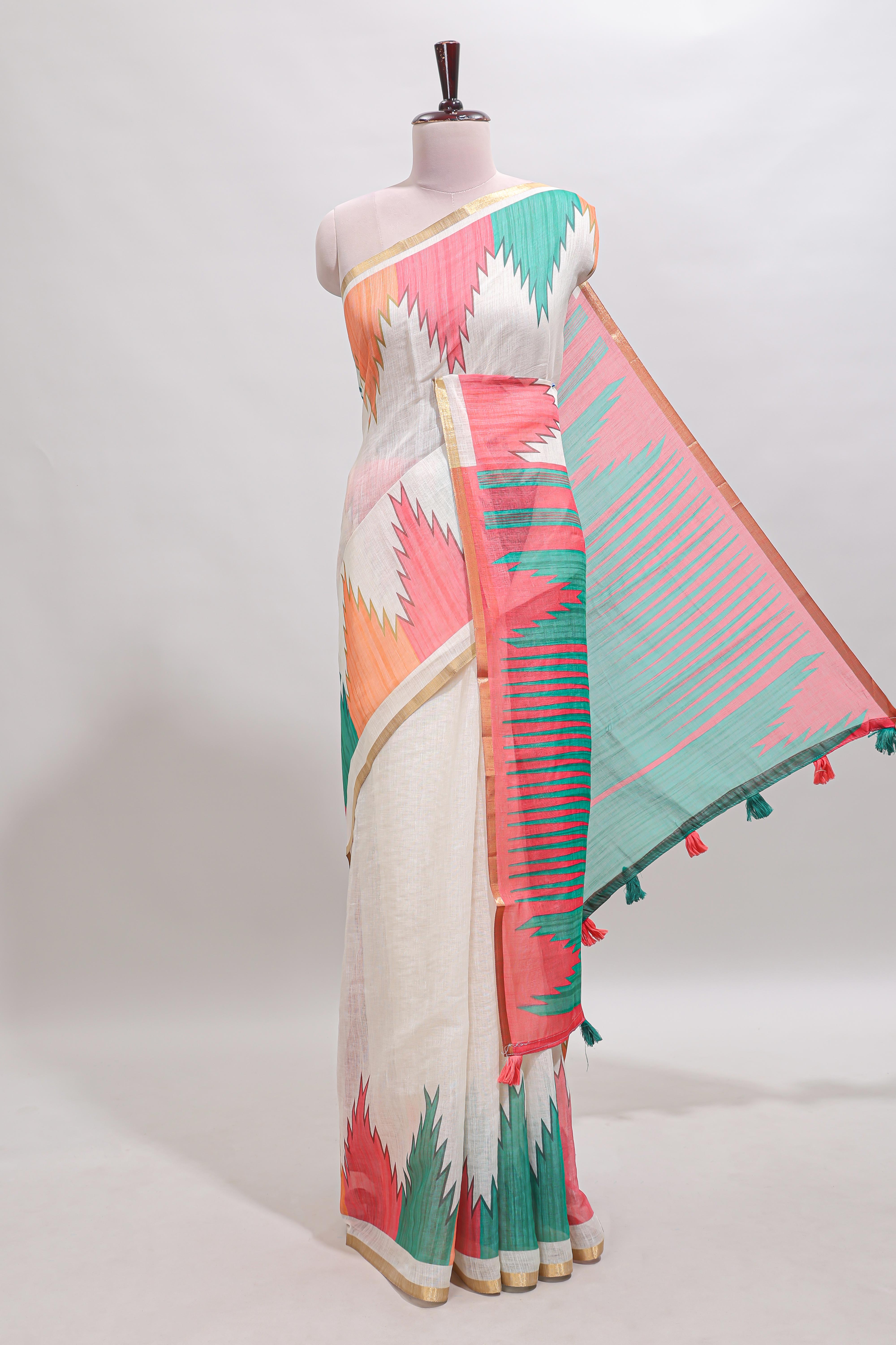 Cream ikkat style linen cotton saree with self zari border and contrast blouse