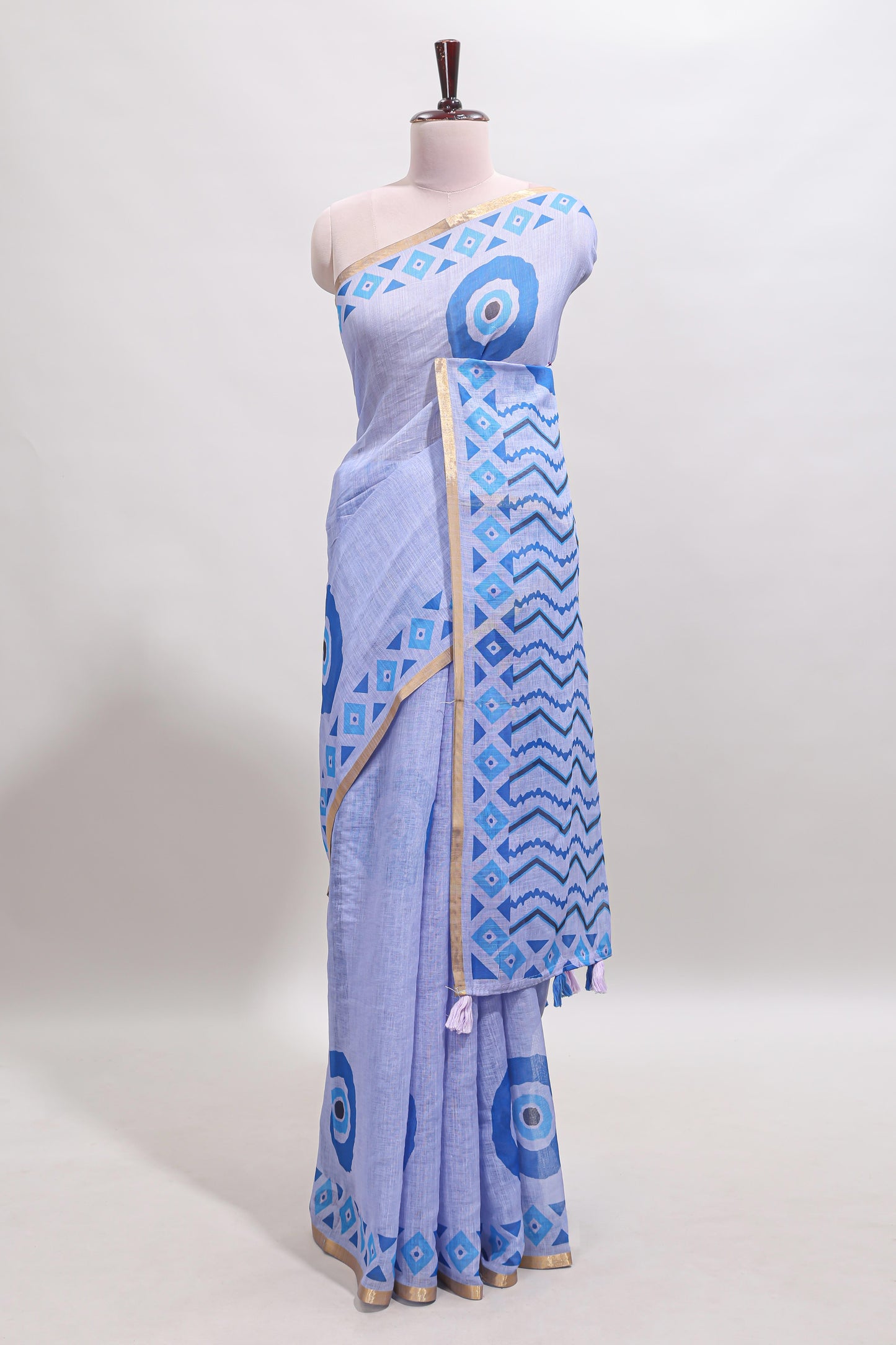 Blue nazar print design linen cotton saree with self zari border and contrast blouse