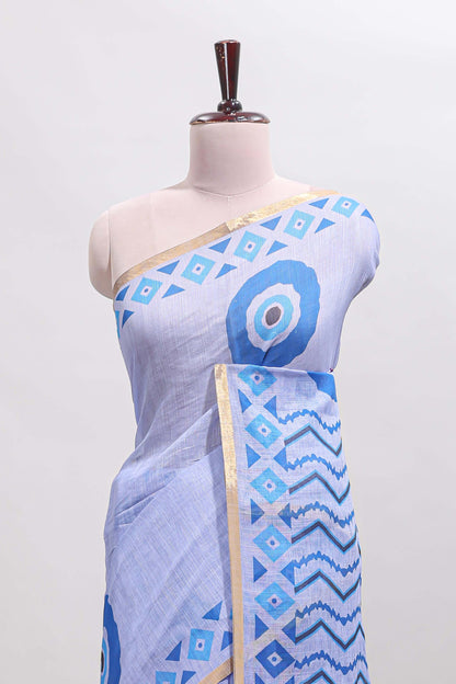 Blue nazar print design linen cotton saree with self zari border and contrast blouse