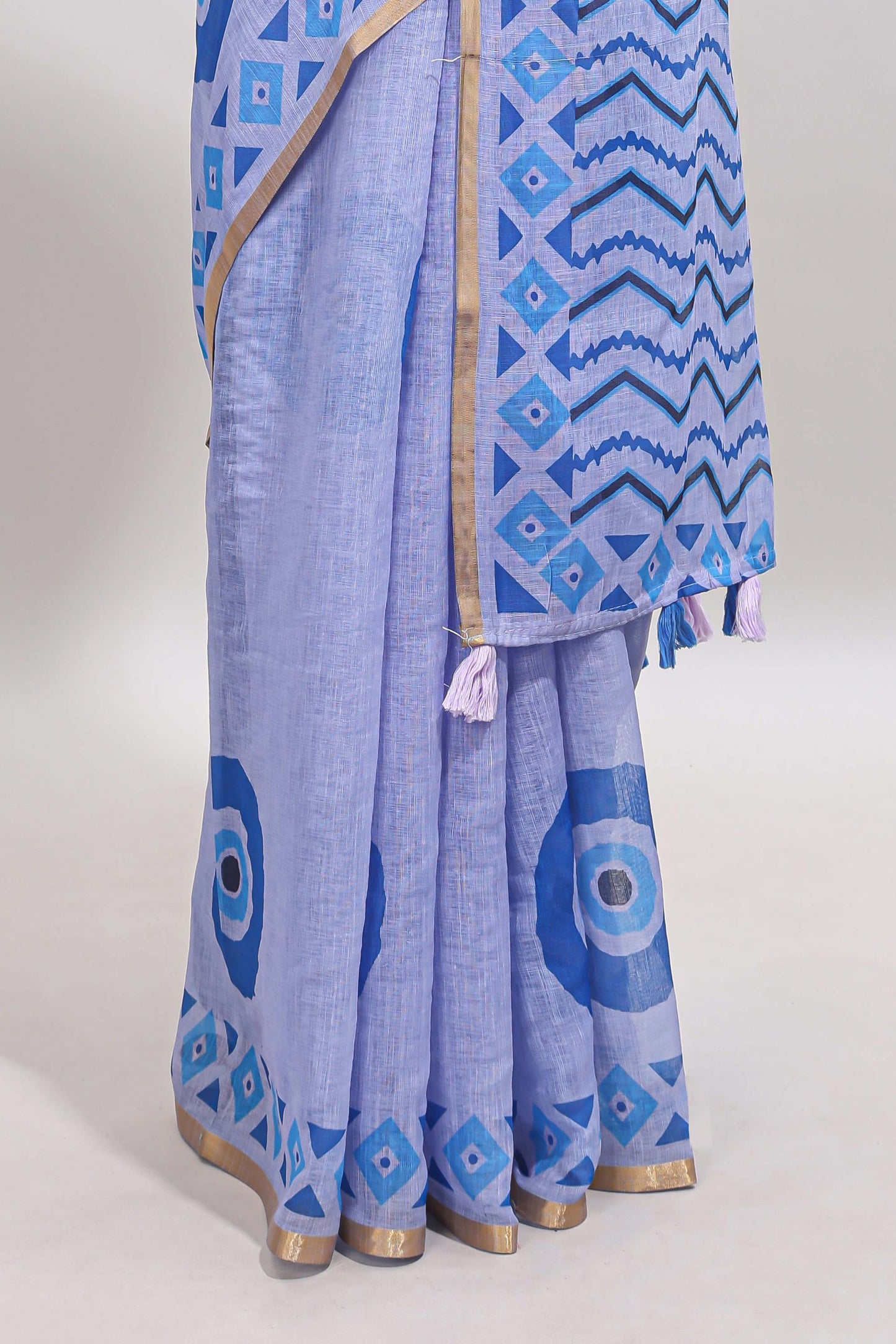 Blue nazar print design linen cotton saree with self zari border and contrast blouse