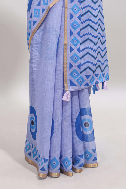 Blue nazar print design linen cotton saree with self zari border and contrast blouse