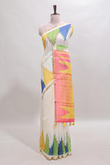 Cream ikkat style linen cotton saree with self zari border and contrast blouse