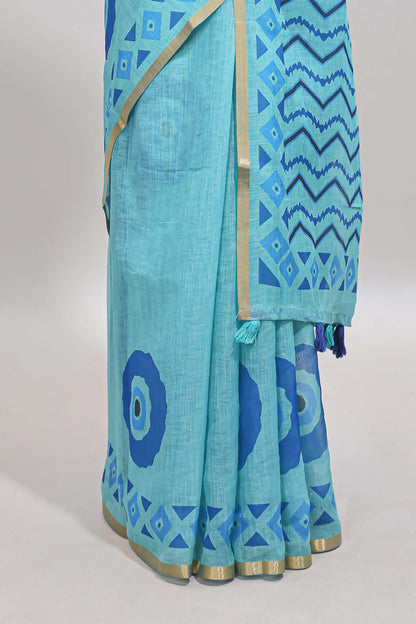 Turquiose green nazar print motifs design linen cotton saree with self zari border and contrast blouse