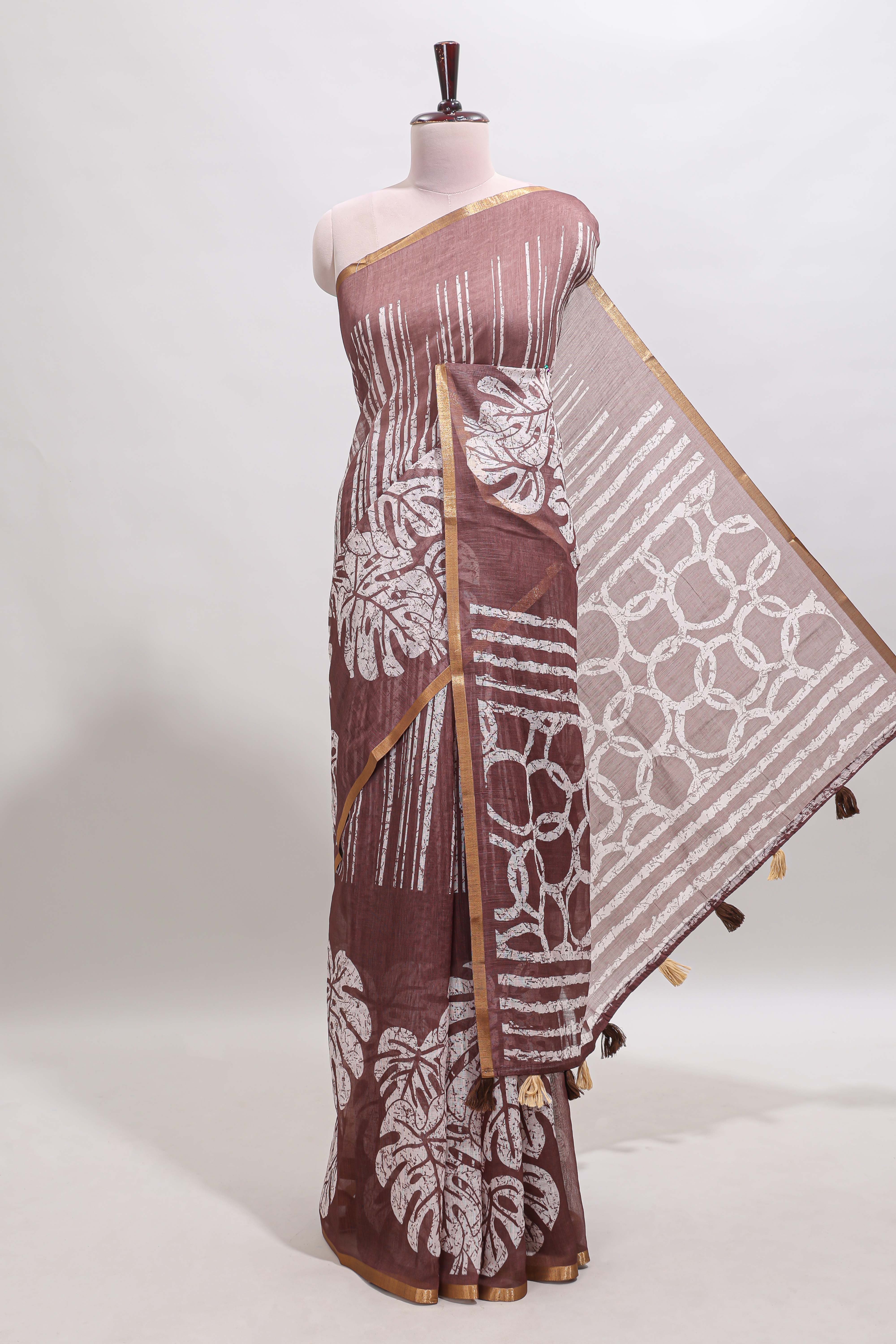 Brown striped & leaf design linen cotton saree with self zari border and contrast blouse