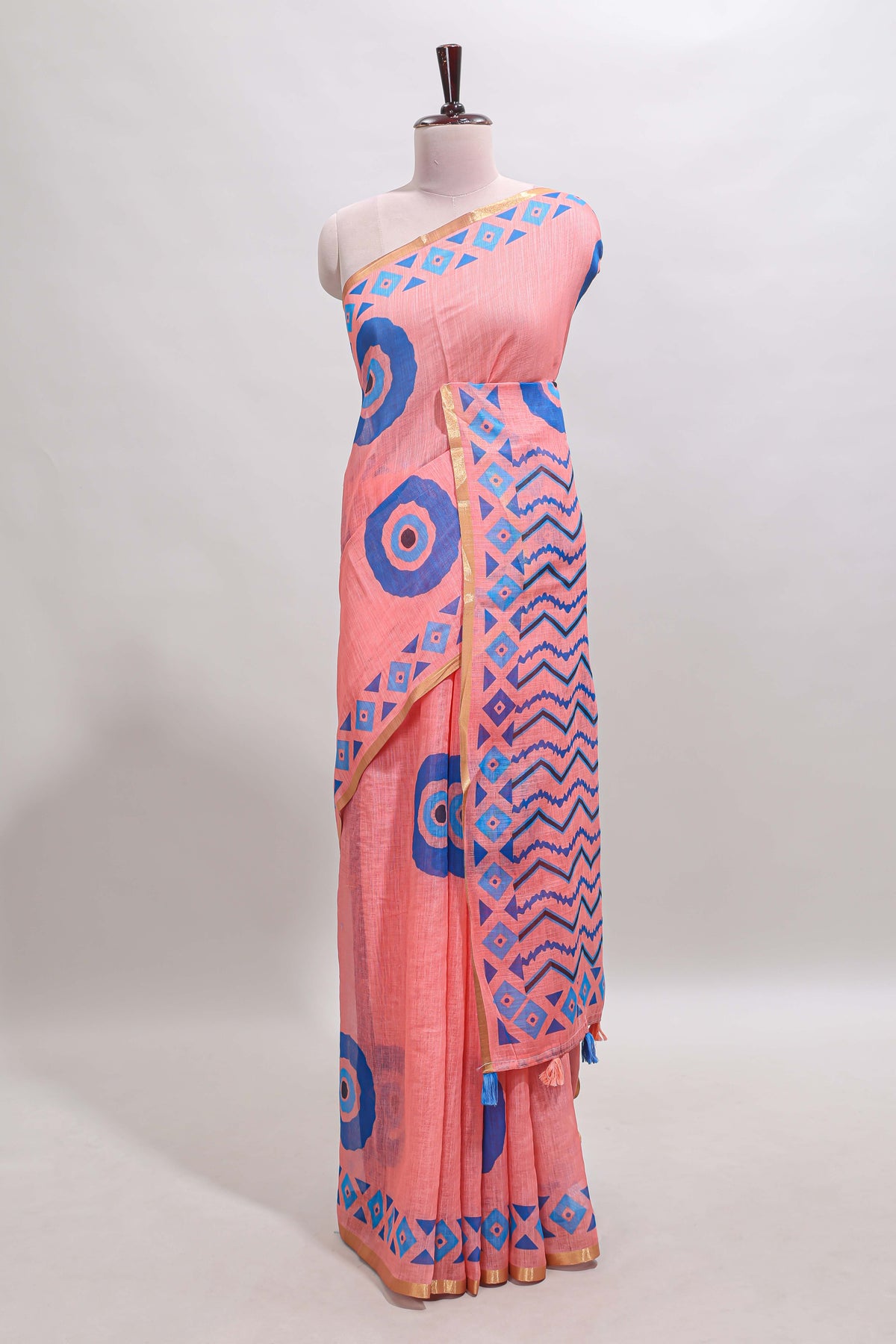 Orange nazar print motifs design linen cotton saree with self zari border and contrast blouse