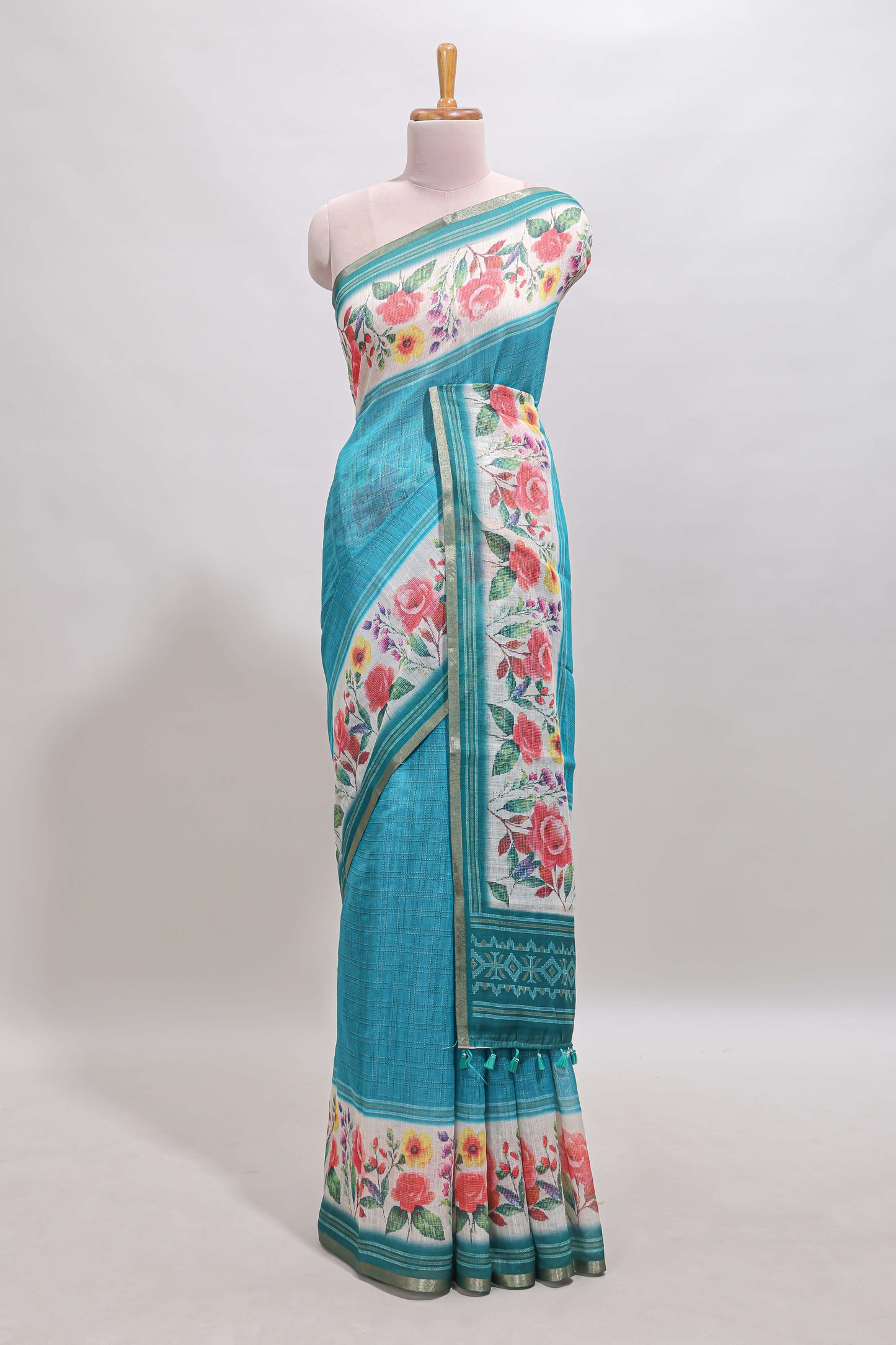 Green checked bottom floral design linen cotton saree with self zari border and matching blouse