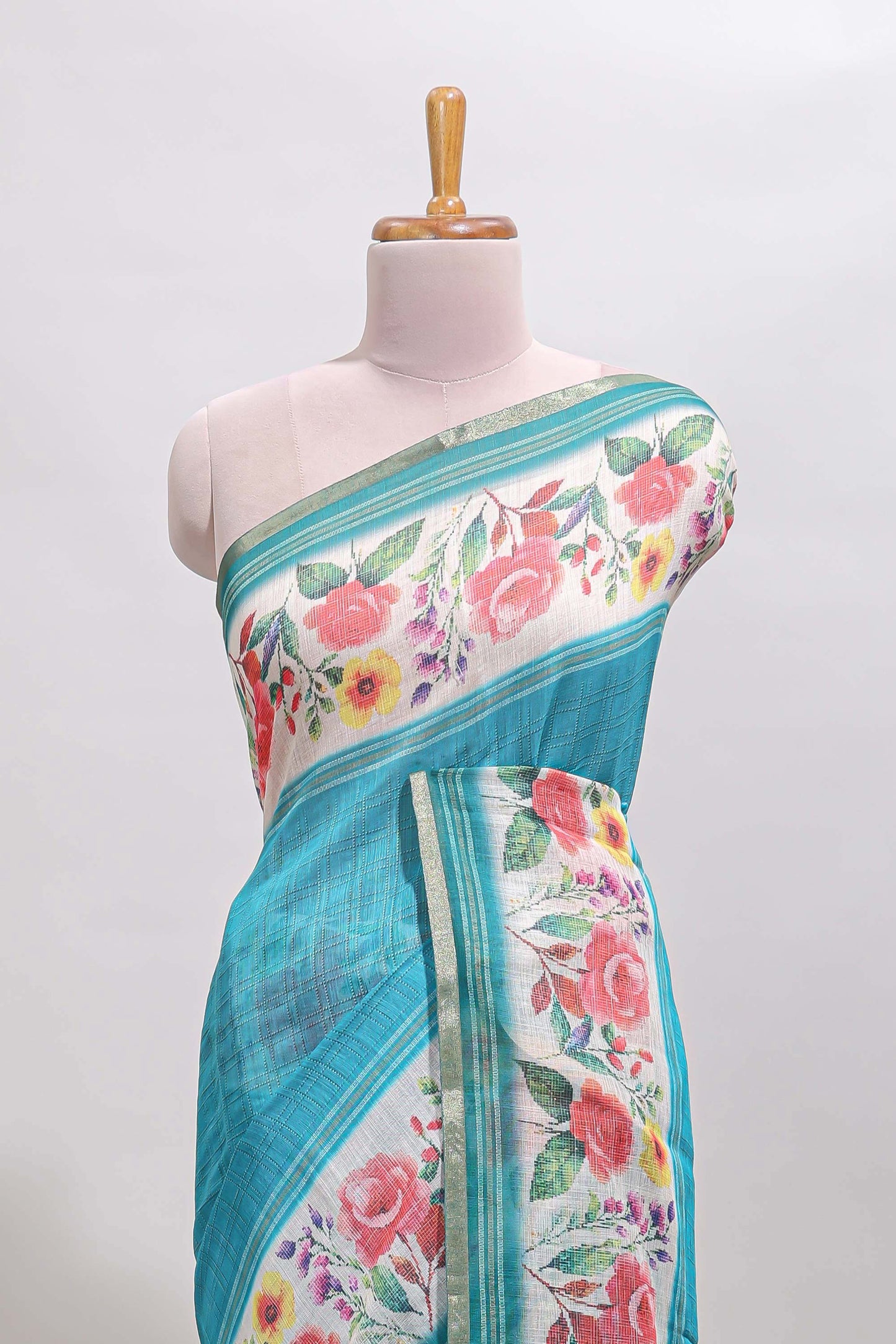 Green checked bottom floral design linen cotton saree with self zari border and matching blouse
