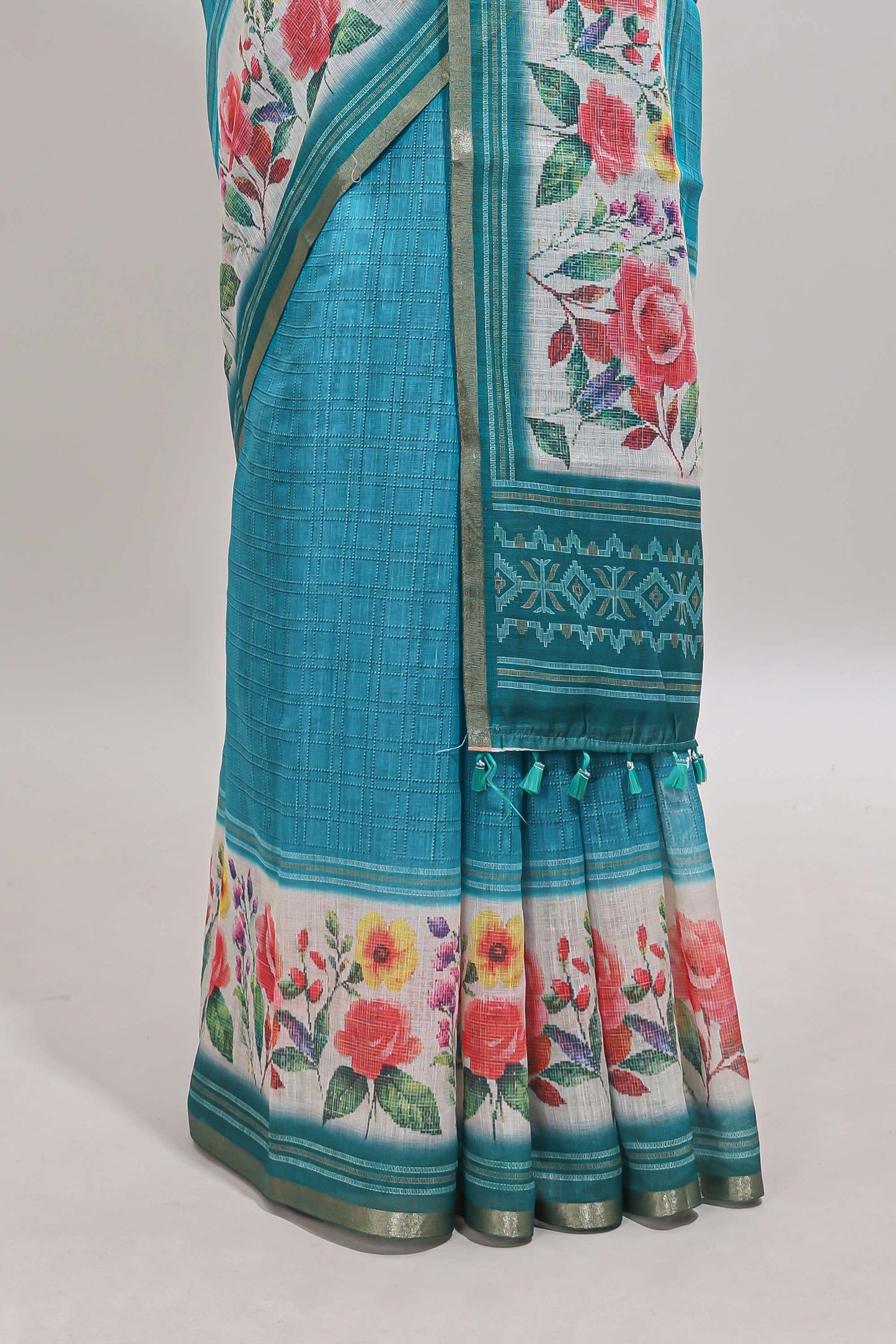 Green checked bottom floral design linen cotton saree with self zari border and matching blouse