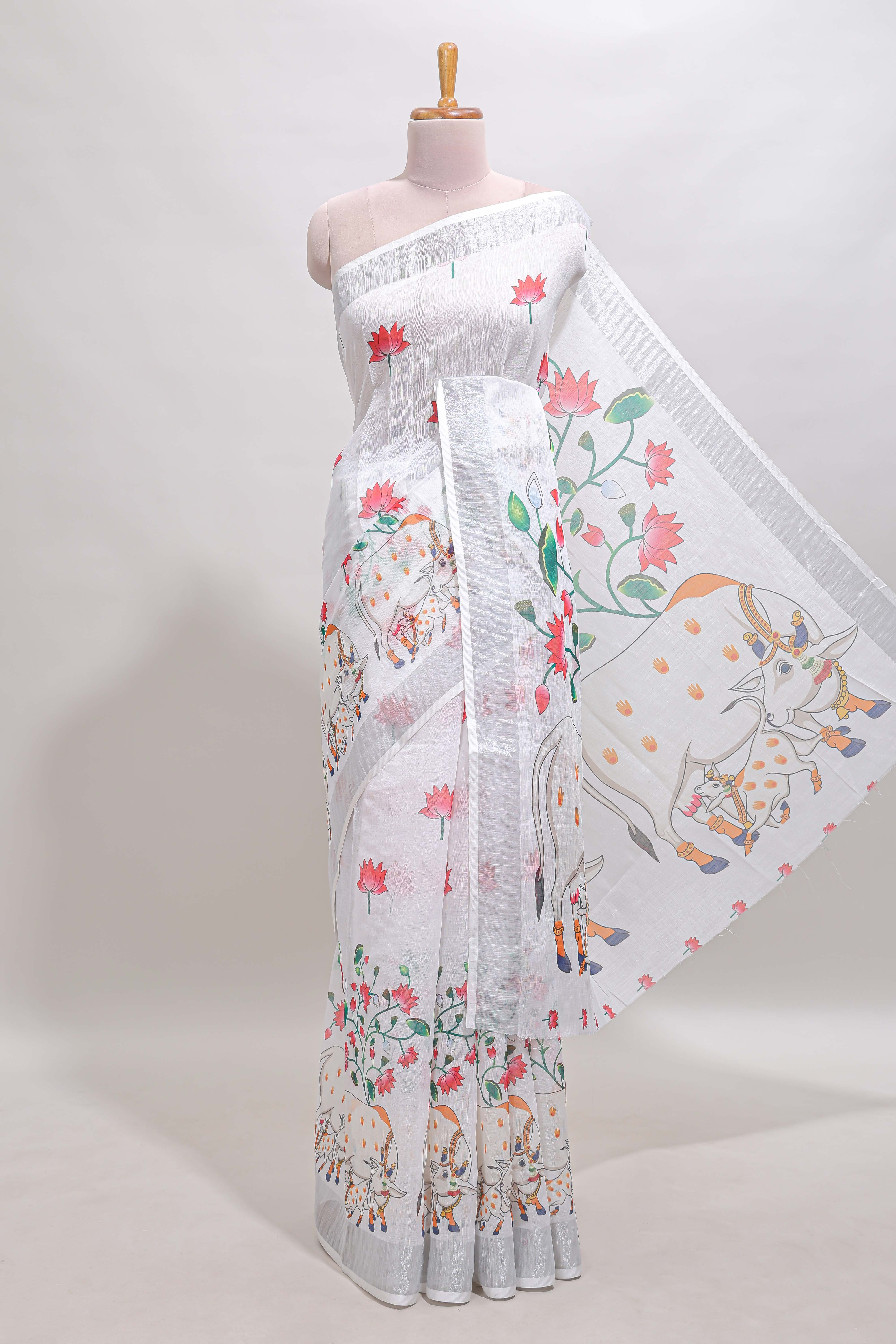 White floral & cow design linen cotton saree with self silver zari border and matching blouse