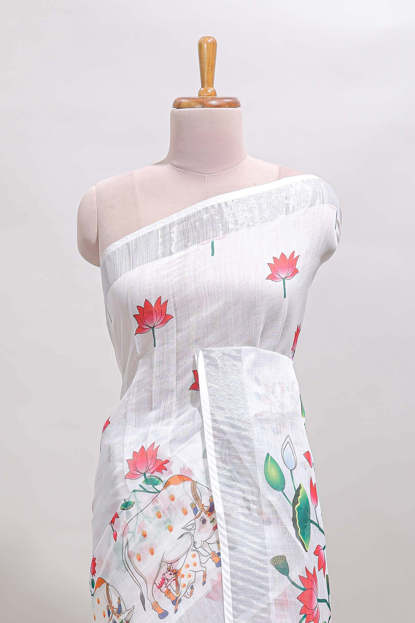 White floral & cow design linen cotton saree with self silver zari border and matching blouse