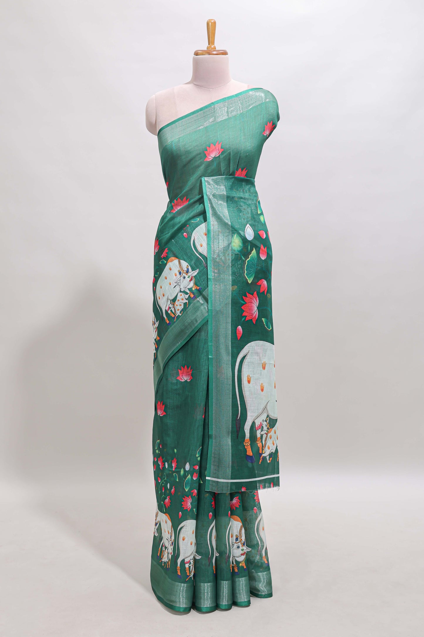 Green floral & cow design linen cotton saree with self silver zari border and matching blouse