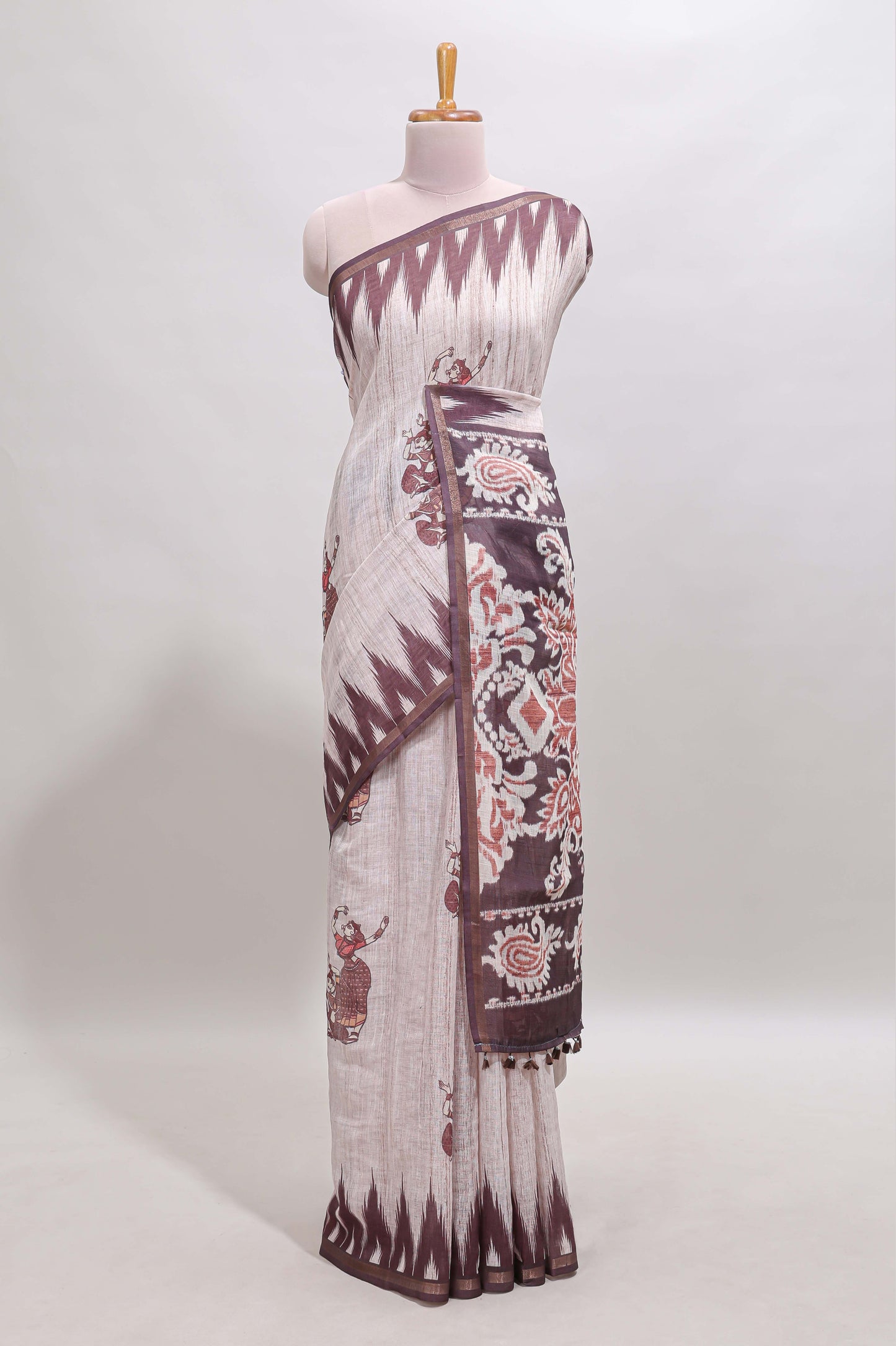 Off white tribal dance dance motifs linen cotton saree with contrast ikkat border and printed pallu