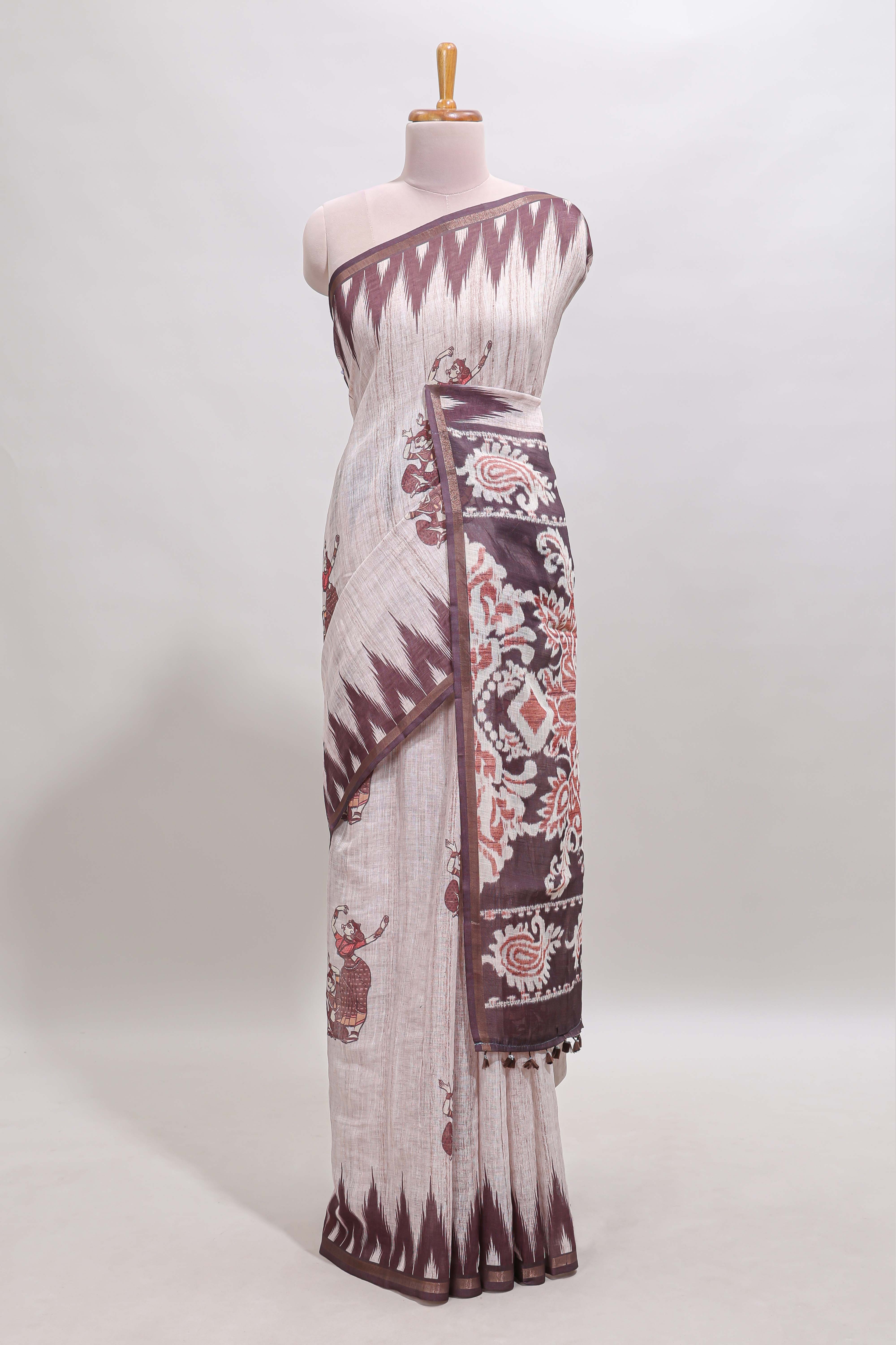 Off white tribal dance dance motifs linen cotton saree with contrast ikkat border and printed pallu