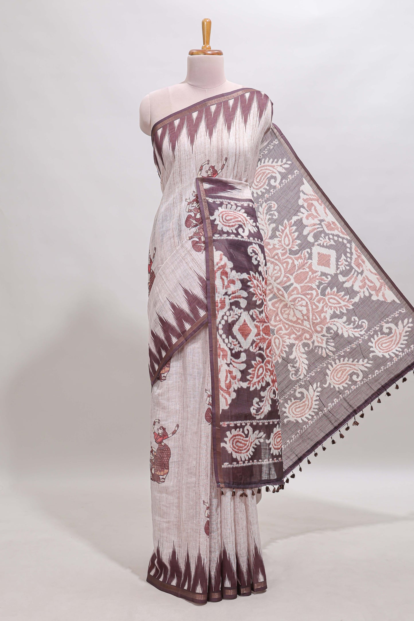 Off white tribal dance dance motifs linen cotton saree with contrast ikkat border and printed pallu