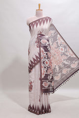 Off white tribal dance dance motifs linen cotton saree with contrast ikkat border and printed pallu