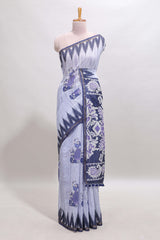 Lavender tribal dance dance motifs linen cotton saree with contrast ikkat border and printed pallu