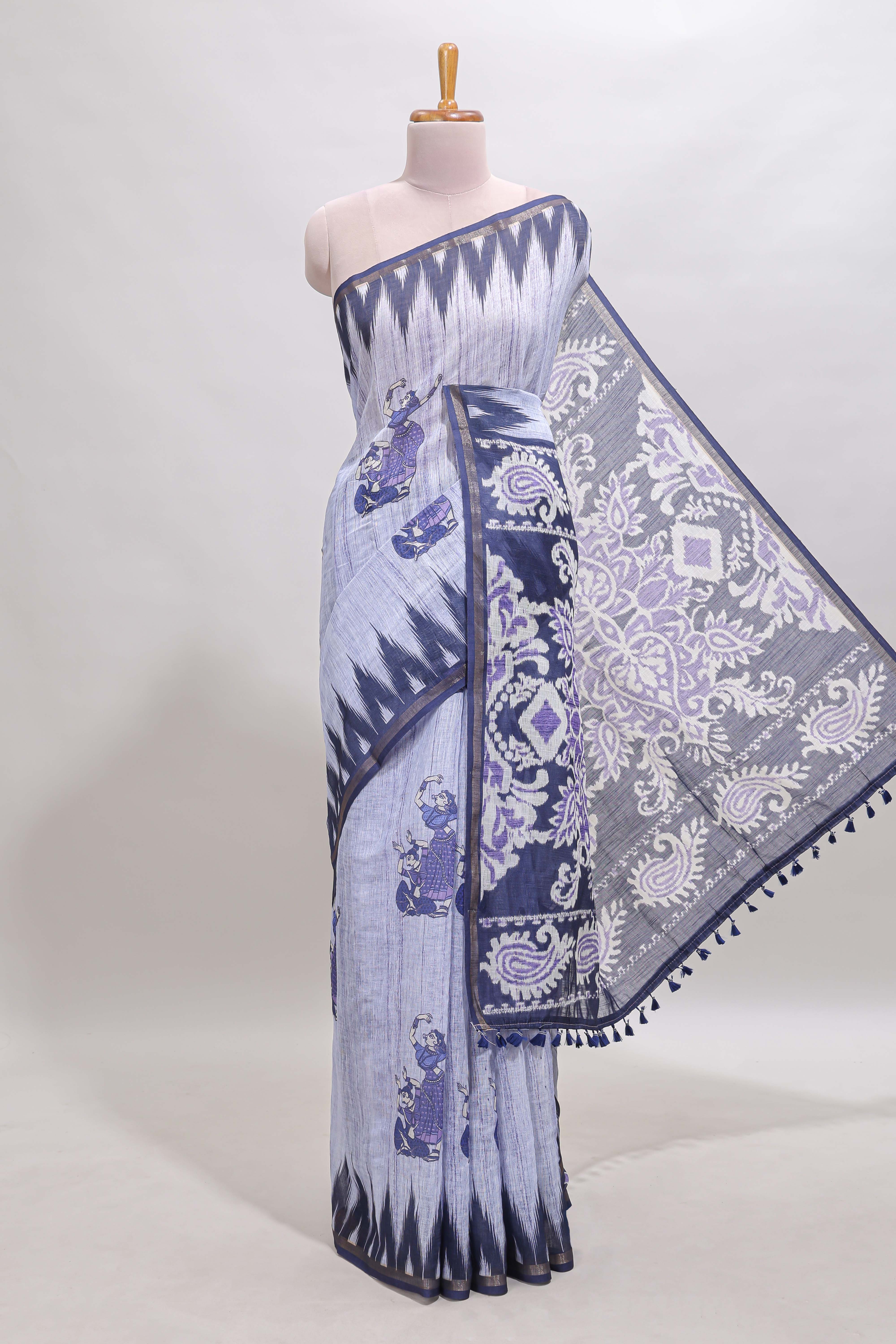 Lavender tribal dance dance motifs linen cotton saree with contrast ikkat border and printed pallu