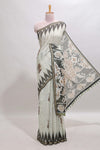 Green tribal dance dance motifs linen cotton saree with contrast ikkat border and printed pallu